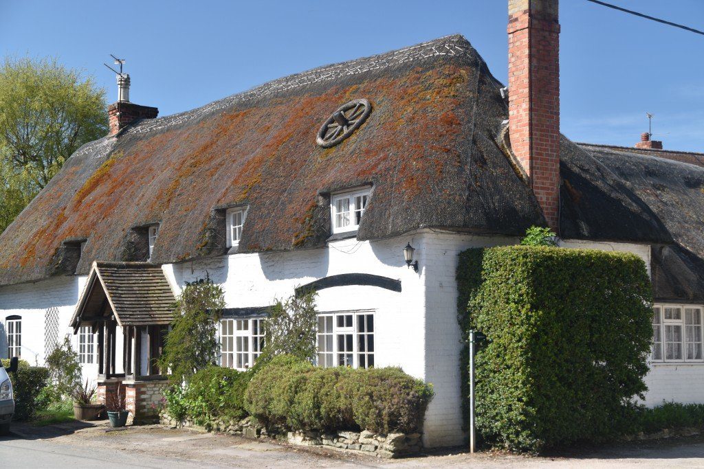 The Ridgeway, cute thatched cottage with cartwheel in the roof