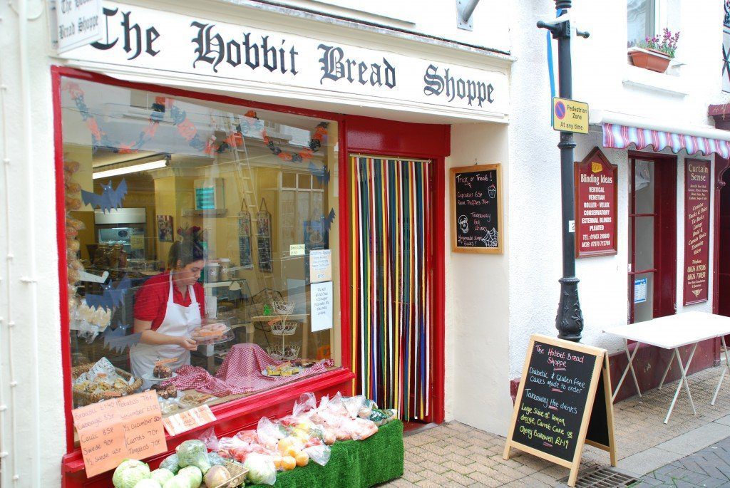Lady dressing window of Hobbit Bread Shoppe, Teignmouth