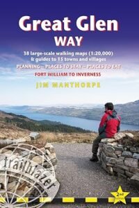 Front cover of Great Glen Way book with author sitting on stones looking over Loch Ness